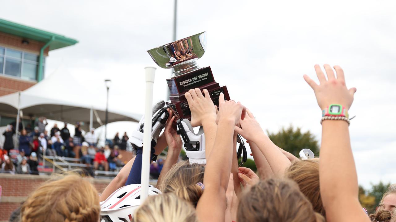 Players holding up Brogden Cup trophy