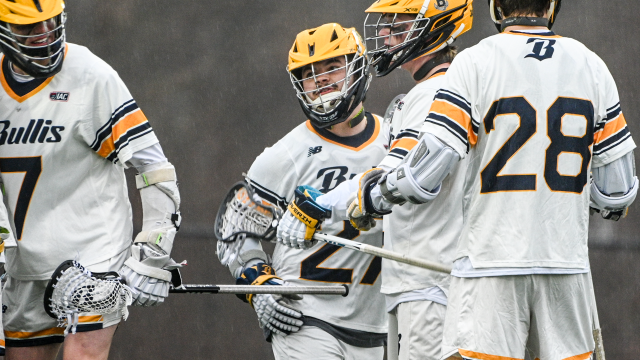Avi Ruiz of Bullis (Md.) lacrosse is congratulated by teammates after scoring a goal against Good Counsel (Md.).