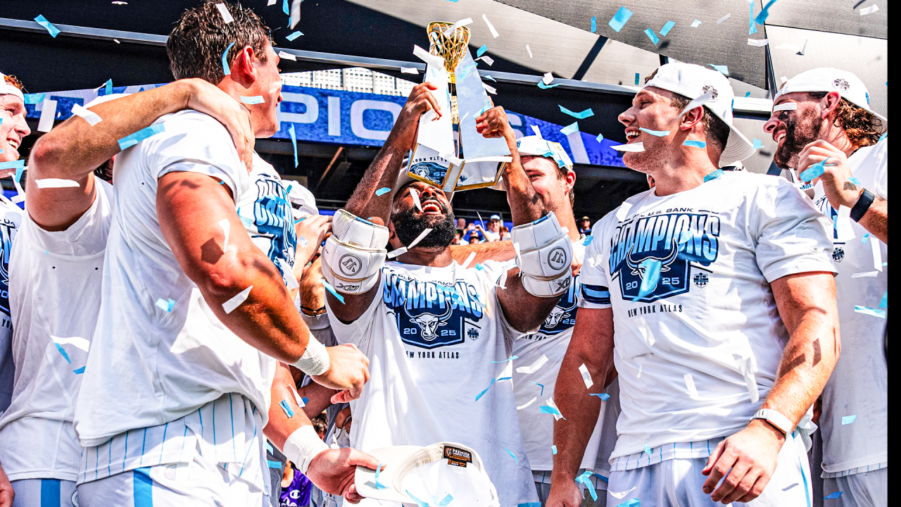 New York Atlas captain Trevor Baptiste hoists the PLL championship trophy during a celebration at Sports Illustrated Stadium in Harrison, N.J.